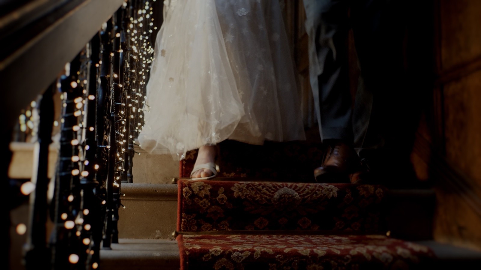 Wedding shoes on a softly lit staircase